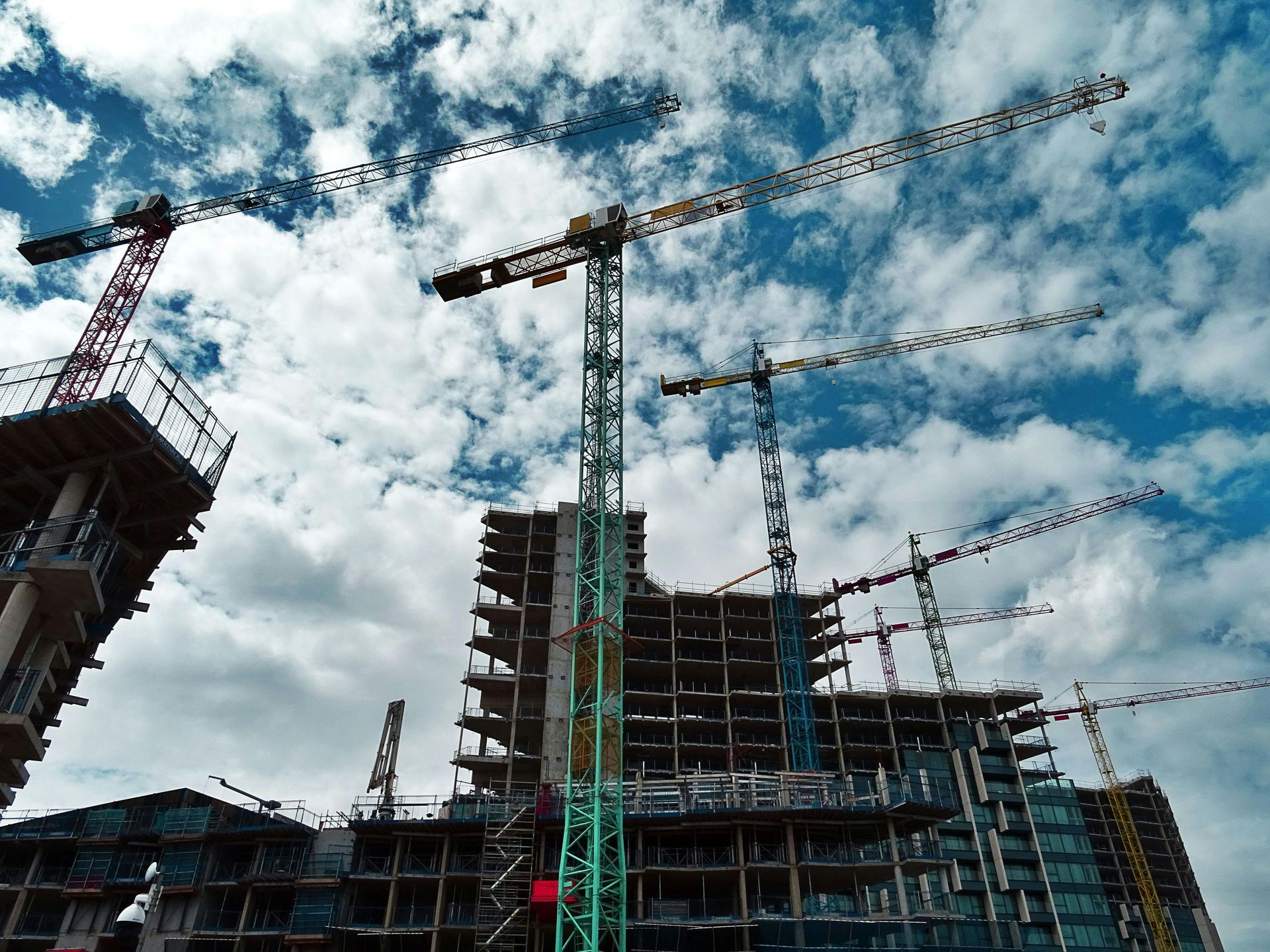 Commercial construction cranes at a Calgary job site